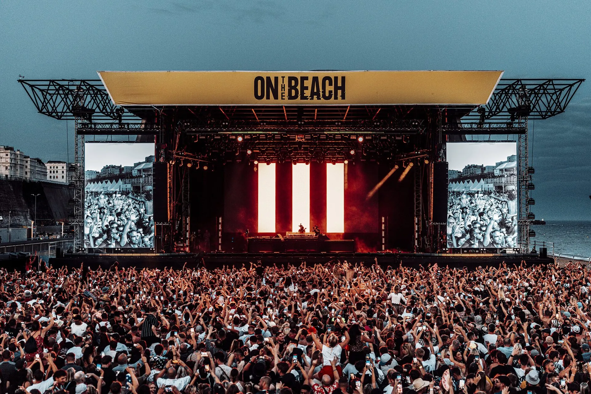 Beach festival atmosphere at sunset